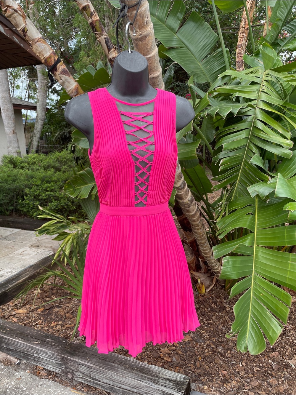 Bebe pleated minidress with sheer lace cut out